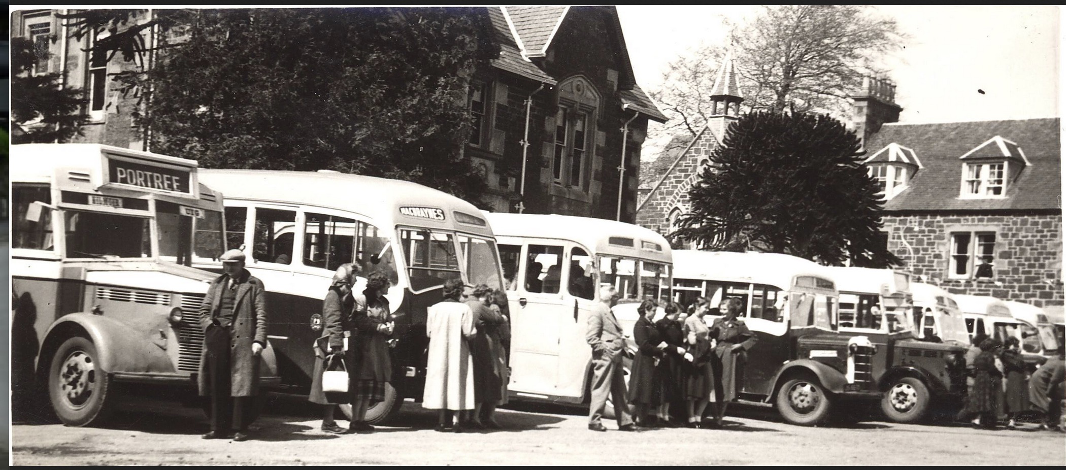 A bus day in Somerled Square, Portree. A line of 8 buses with Macleods bus to Duntulm and Kimaluag on the left